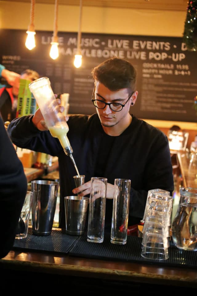 Bartender pouring a shot