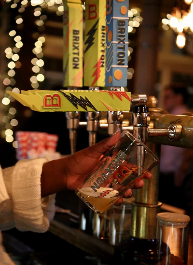 Someone pouring a pint